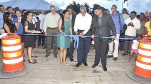 President Granger participating in the symbolic ribbon-cutting ceremony for the commissioning of the GAICO Wharf Facility and Trailing Suction Hopper Dredge.