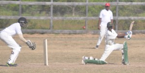 Junior St Clair plays a spanking square drive during his unbeaten 104 on Sunday at the Area ‘H’ ground in Rose Hall Town.