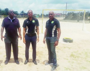 Clinton Urling (centre), FIFA’s Development Officer Mr. Howard McIntosh (left) and Referee Stanley Lancaster check out the Beach Football facility at Bayrock ground.