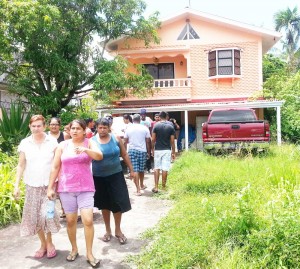 Shocked neighbours and relatives leave the home of murdered Carmen Ganesh.