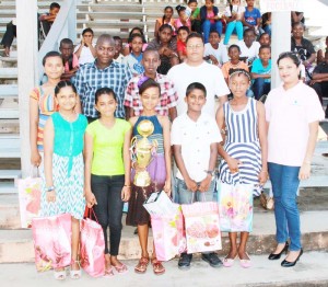 The top Awardees pose with Seema Brijmal of Republic Bank and Camp Director Rohan Etwaru.  