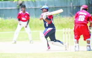 Vivian Albert launches  into National U-17  leggie Tameshwar  Motiram during  his unbeaten 117.