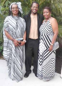 Dawn Holder-Alert (r) and Duane Holder, children of Terry Holder, with the other inductee, Rose Willock, a broadcaster from Montserrat.