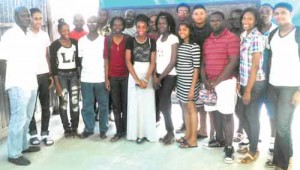 (From left) Sir Orin Morgan and a group of the students, who recently wrote CSEC, along with their parents.