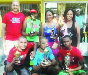 Flashback! Courts’ Country Manager, Clyde de Haas, (standing, left) takes a photo opportunity with staff who completed the 3km Walk/Jog in the past.