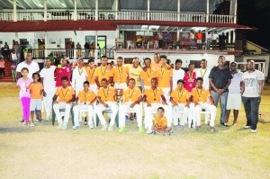 Members of the victorious DCC team display their accolades. DCC President Alfred Mentore is standing far left while Garvin Nedd is standing third from right. 