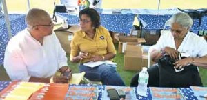 Minister Hughes in discussions with Dr. Vibert Cambridge and MS Ave Brewster-Haynes, President and Vice President of the Guyana Cultural Association of New York