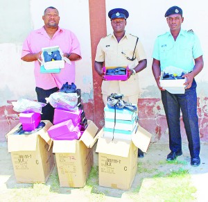 Hilbert Foster (left) with the GPF officers following the presentation.