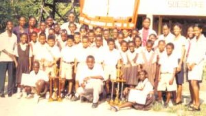 Second from left, Ms Thomas with staff and students of the Soesdyke Primary School. 