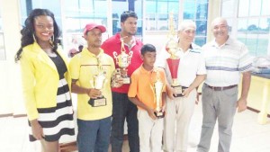 From left: Ms Alicia Bess, Sam Harry, Richard Haniff, Laksmana Ramroop, Roberto Grissi and President Shyam Ramroop after the presentation of prizes.