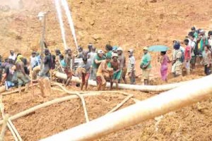 The Mowasi mining pit, with one of the victims being extracted