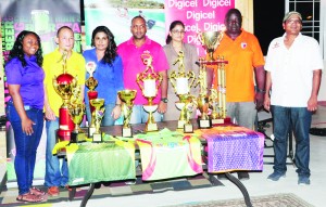 Representatives of the organising body and sponsors with the trophies and team uniforms 