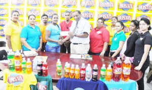 Guyana Beverage Inc., CEO Mr. Robert Selman (right) hands over the sponsorship cheque to EBSC Secretary Ms. Kavita Yadram in the presence of company and club officials.   