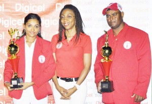 Marketing Executive Jacqueline James (centre) poses with winners Avinash Persaud and Joann Deo last year.