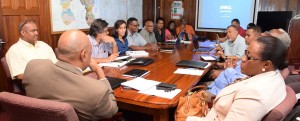 Minister of Governance, Raphael Trotman, meeting with the Board of  Directors of the GGMC yesterday. Also in picture is Minister within the  Ministry of Social Protection, Simona Broomes. 