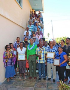 President Granger and Minister Henry pose with other awardees following the Silver Jubilee Anniversary Celebration at the St. Francis Community Developers Complex.