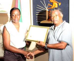 Minister Nicolette Henry receives Honorary Membership from RHTY&SC President, Keith Foster.