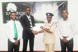  Director of Sport, Christopher Jones (second, left) hands over the sponsorship cheque to Division ‘A’ Commander, Clifton Hicken in the presence of Banks DIH Water Manager, Errol Nelson and Coordinator, Colin Haynes last week.