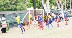 St. Pius vs North Georgetown: caption- Action in the clash between St. Pius and North Georgetown yesterday, at the Banks DIH ground, Thirst Park.