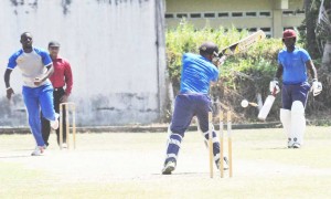 Umpire Zaheer Mohamed watches as Imran Hassan is bowled by Raymond Reifer.