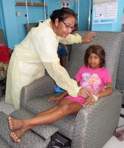  A nurse at the GPHC’s Oncology department attending to Shelly  