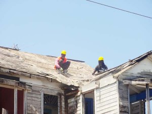 Demolition crew at work atop of lot 135 Waterloo Street  