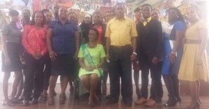 Ms Margaret Joseph (sitting) enjoys her final moments at the school surrounded by Headmaster (ag) Kirwin Mars (L) and other teachers.