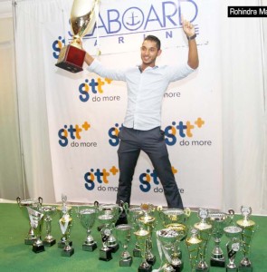 Caribbean champion Kristian Jeffrey seen in celebratory mood with his hardware folowing the conclusioin of the presentation ceremony.