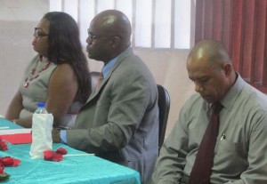 Regional Education Officer Mrs. Marcia Paddy-Andrews (left) CEO Olato Sam (centre) and Pastor Selwyn Sills at head table.