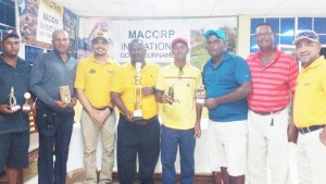 The winners pose with reps of MACORP. From left:- Avinash Persaud, Pur Persaud, Mr Escaraga, M. Gayadin, S. Harry, M. Bhagwandin, Patrick Prashad, and M. Oviedo.