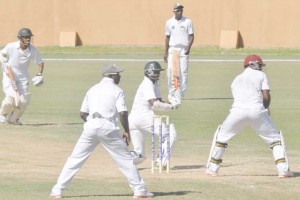 Shiv Chanderpaul sweep Shillingford for four during  his top score of 34 at Providence yesterday.