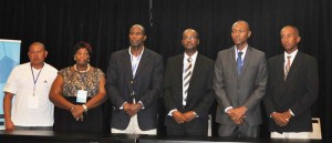  Newly elected President of the GFF Wayne Forde (3rd right) poses with executive members (from left) - Raiyan Farias, Keith O’Jeer, Dion Inniss, Bruce Lovell (Brig Ret’d) and Magzene Stewart yesterday at the Marriott Hotel. 