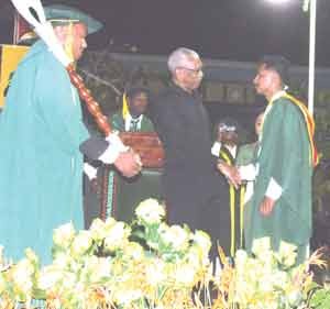 Best graduating student, Sachin Ramsuran, as he receives The President’s Medal from President David Granger