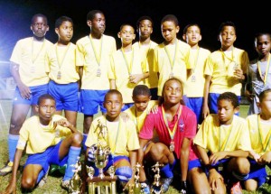  BFA 2015 U-13 champs, Bartica A, display their trophies and medals.