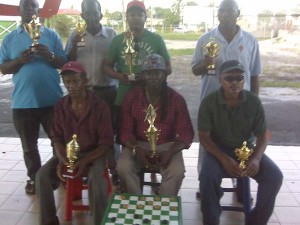 The respective top performers display their accolades. (Front row) B Winner Linden Heywood (centre) is flanked by Ulric Braithwaite (left) and Navin Neighbarran. (Standing front left) Floyd Cumberbatch, Mark Braithwaite, A class winner Khemraj Pooranmall and Keith Bacchus.