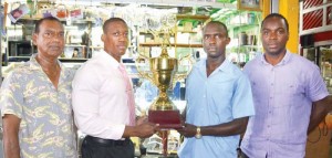 THE TWO CAPTAINS FACE OFF AT Trophy Stall yesterday with Ramesh Sunich (left) and Esan Griffith looking on.