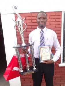 Proud moment: After 10 years of service detective Sergeant Rodwell Sarrabo stands with his awards for best detective for the year 2015. 