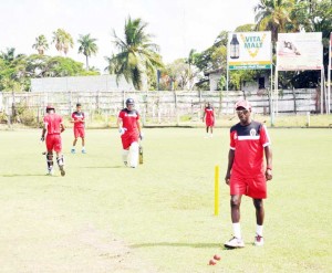 Coach David Williams (with shades) takes his charges through practice sessions at Bourda after the match was called off.