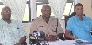 From left: National Coordinator of Community Policing Groups (CPGs) Dennis Pompey, Traffic Chief Dion Moore and  Executive Member of the Guyana National Road Safety Council, Shahab Hack. 