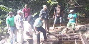 GWI CEO Dr. Richard Van West Charles (centre)  and Senior Managers examining sections  of the Mahdia water supply system.