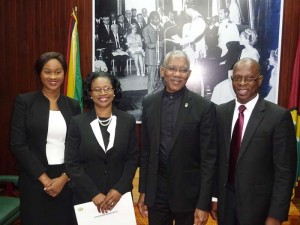 A proud family moment: Acting Chief Justice Yonette Cummings-Edwards in the presence of President David Granger shares a joyous moment with her daughter Dr. Yana-Marisa Edwards and husband Dr. Morris Edwards. 