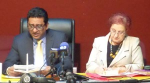  From left: Former Attorney General Anil Nandlall with PPP Chief Whip, Gail Teixeira. Nandlall can be seen reading an excerpt of the APNU+AFC manifesto