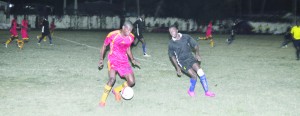 Soesdyke Falcons’ Colin McLean in control but closely watched by Pouderoyen’s Glenvil Hazel.