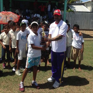 Vishal Persaud - Vishal Persaud (left) collects his award for an outstanding game.