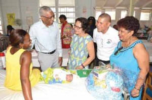 The special visitors with mother of one of the babies born on Christmas Day, Ms. Renita Patterson of Buxton.  This is Renita’s fourth child and first girl. 