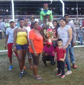 Connections of the Gopaul Singh Stable collect their prize after Little won the J1 and lower event.