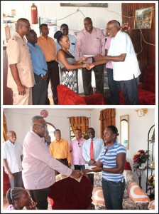 (Above) Ms. Rehanna Bollers, the spouse of Corporal Romain Cleto, receives the donation from Dr. Winston McGowan of Fallen Heroes Foundation Inc. (Below) Foundation President Pastor Raphael Massiah presents the donation to Ms. Enola Pantlitz, the spouse of Corporal Sherwayne Pantlitz. 