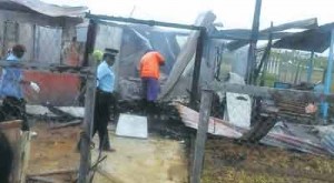 Investigators go through the rubble in search of Baichan’s body.    