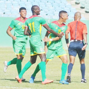 Emery Welshman (left) celebrates fellow Gold Jaguar Brandon  Beresford’s (right) first international goal against St. Vincent. 