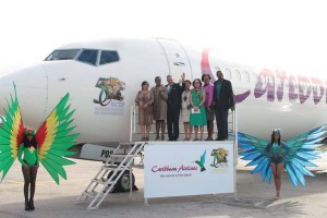 One of Caribbean Airlines aircraft bearing the country’s 50th Anniversary logo along with members of the Government and CAL Chairman